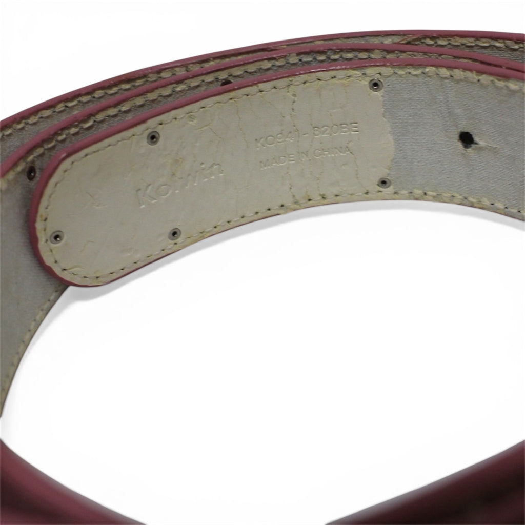 "Pink belt with heart-shaped buckle"